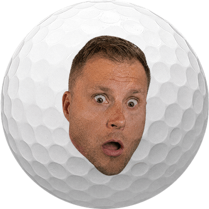 Golf ball printed with a funny surprised face